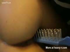 A wild livecam rookie, age 18, performs a painful insertion.